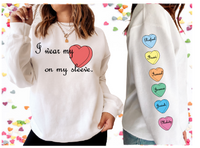 I wear my heart on my sleeve crew neck/ Yo llevo mi corazon en mi manga crew